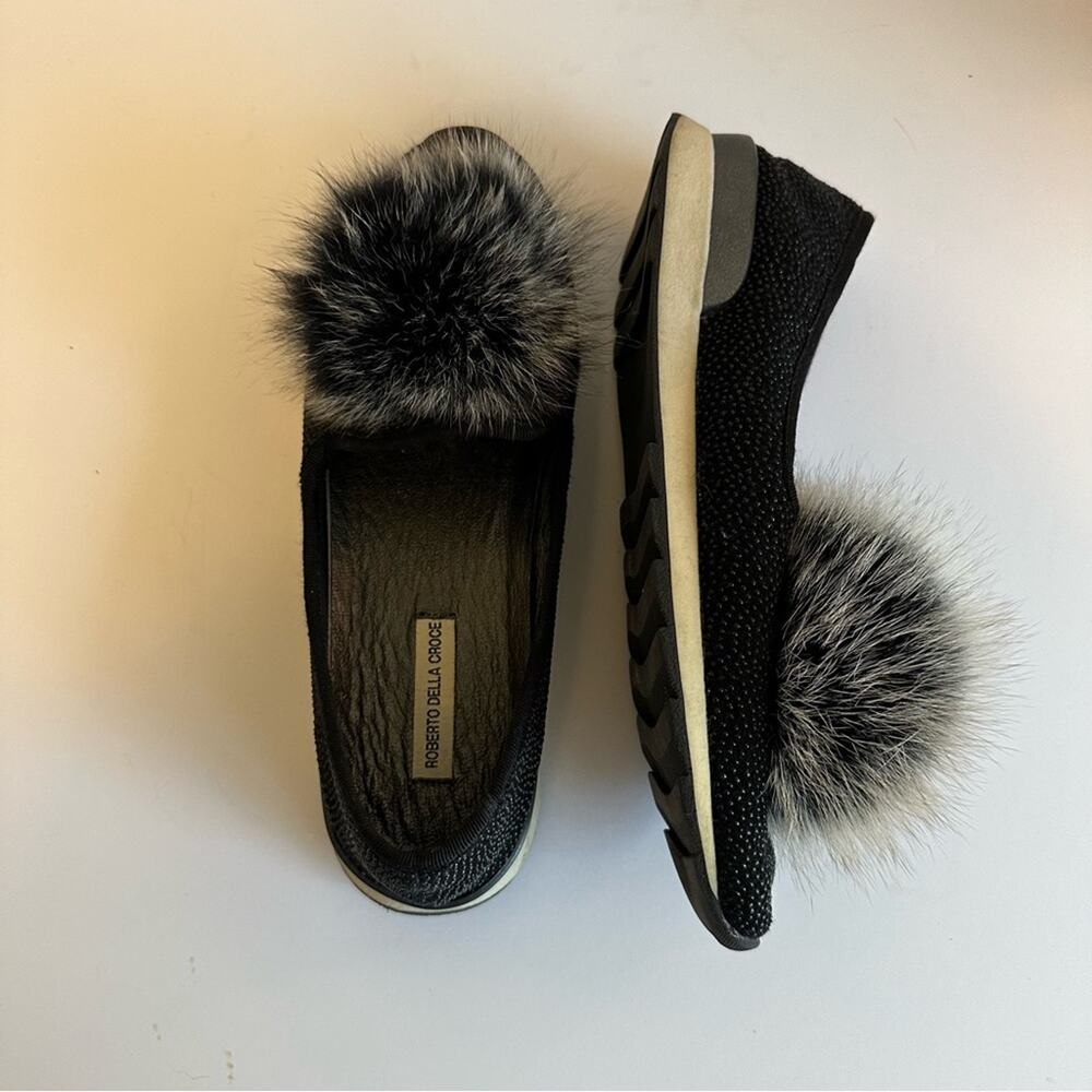 Roberto Della Croce slip-on sneaker style flats w/ furry pom pom embellishments